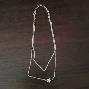 a star necklace, never worn.